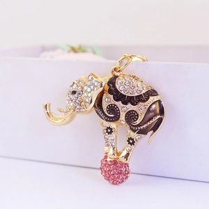 Cute golden circus elephant keychain with sparkling rhinestones and pink ball