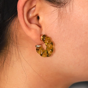 Chic amber resin C-shape hoop earrings with twisted texture and gold accents for women