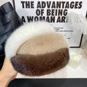 Close-up of tricolor mink fur headband showing soft white, beige, and brown textures
