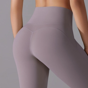 Detailed back view of high waist yoga shorts featuring push up design in misty purple