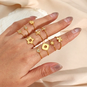 Set of 10 gold plated adjustable stackable rings with cross star heart motifs for women