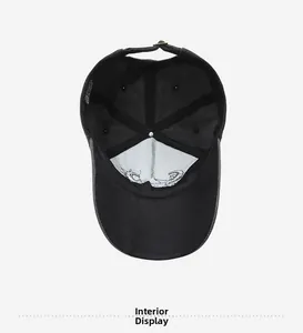 Detail view of the black cotton baseball cap interior showing stitching and care label