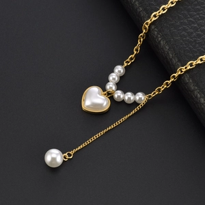 Minimalist gold titanium necklace with heart pearl pendant and elegant fringe drop detail