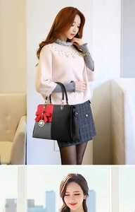 Women's handbag featuring tricolor patchwork in black, red, and gray with bow detail