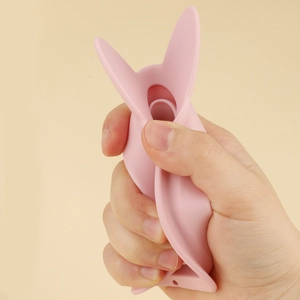 Pink rabbit-shaped silicone makeup brush cleaning mat showing flexible and soft material