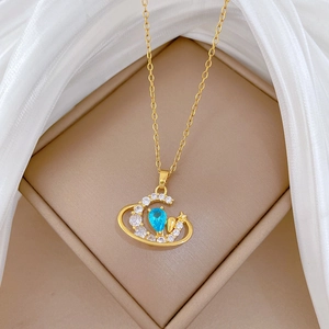 Elegant gold titanium necklace with blue crescent moon and star zircon in jewelry box