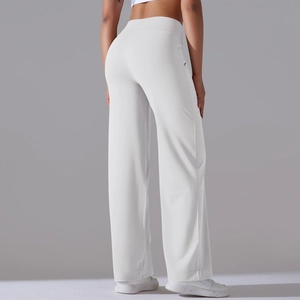 Detail view of high waisted white wide leg yoga pants with side pockets and relaxed fit