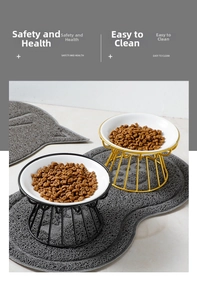 Close-up of white ceramic elevated cat bowls with gold and black metal stands on grey mat