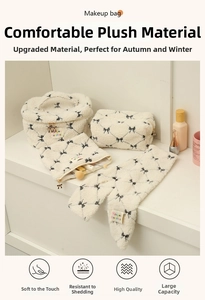 Detailed plush makeup bag set with cream lamb wool texture and black bow patterns
