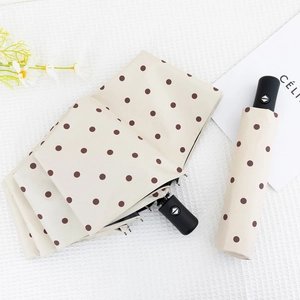 Automatic folding beige umbrella with brown polka dots and anti-UV black coating