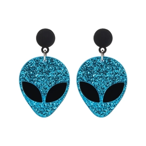 Minimalist blue glitter alien earrings with black studs on white background