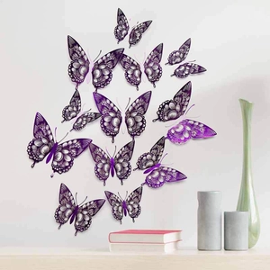 Detailed view of purple hollow-out butterfly wall stickers flying over a desk setup