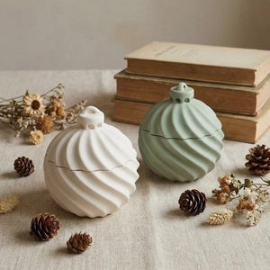 Detailed view of striped resin storage jar molds with elegant matte ceramic textures