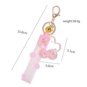 Pink cherry blossom quicksand keychain with acrylic flower pendant and lucky strap