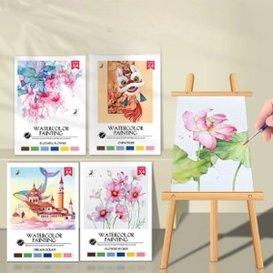 Detail showing 4 sheets of watercolor painting paper with built-in paint palettes