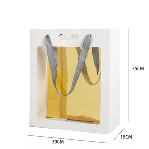 Detailed view of white gift bag with clear window and 35x30x15cm size dimensions