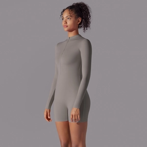 Side view of dark gray long sleeve athletic bodysuit with zipper neck and slim fit texture