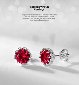 Macro shot of S925 silver flower stud earrings with vibrant ruby and white zircon stones