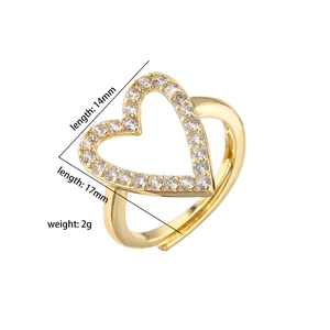 Detail view of heart-shaped gold ring with zircon stones, showing 17mm size dimensions