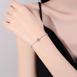 Elegant S925 sterling silver bracelet with blue moissanite four-leaf clover charms