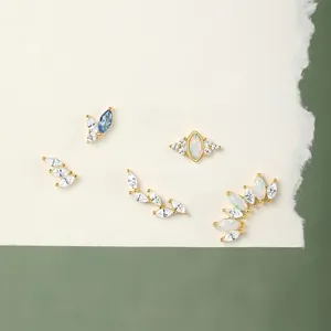 925 silver marquise studs featuring opal and zircon heart designs on sage green background