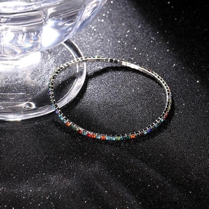 Macro shot of 2.0mm colorful rhinestones on a silver stretch bridal bracelet