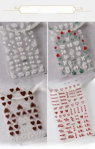 Detail of 5D embossed nail stickers featuring floral hearts and relief patterns