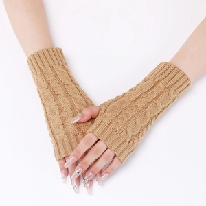 Close-up of khaki knit fingerless gloves showing thick cable texture and warm wrist covers