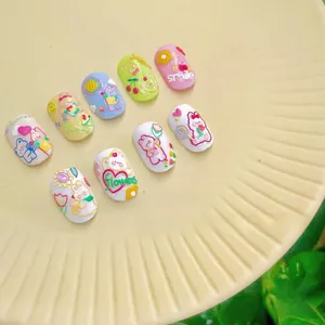 Close-up of 5D embossed nail stickers featuring cute 3D blue bears and pastel flower designs