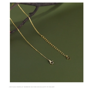 Detailed macro view of S925 sterling silver lobster clasp with heart-shaped tail pendant