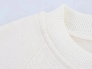 Detailed close-up of high-density ribbed neckline with double-needle stitching on white hoodie