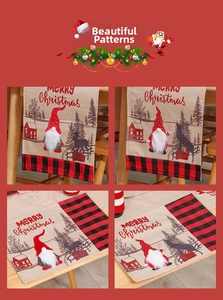 Detail of Christmas table runner and placemat set with gnome motifs and buffalo plaid trim