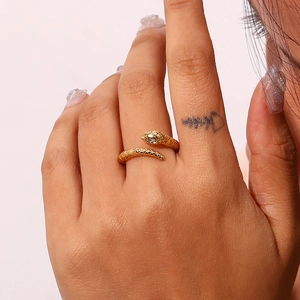 Gold-plated stainless steel snake ring with scale texture and clear zircon eyes