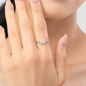 Minimalist S925 sterling silver ring with emerald-cut zircon stone on model hand