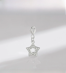 Macro view of S925 sterling silver star pendant with micro-pave cubic zirconia setting