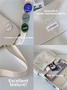 Waterproof white messenger bag with 4 badges showing large A4 capacity and wide strap