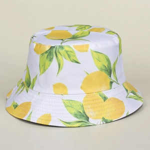 Reversible white cotton sun hat with vibrant lemon and green leaf pattern print