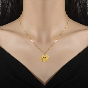 Close-up of gold titanium steel necklace featuring a traditional Ruyi lock pendant with Fu character