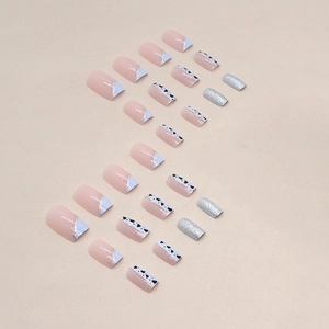 Blue and pink French tip press-on nails with heart patterns and silver glitter accents
