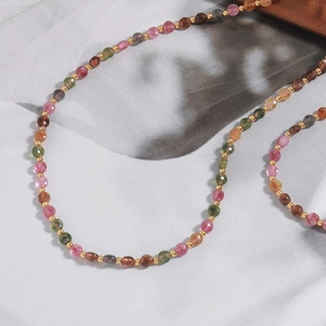 Handmade beaded necklace with multicolored natural tourmaline stones and gold spacers