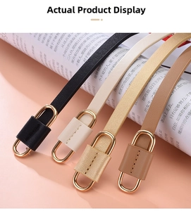 Detail of slim women's waist belts in black, beige, gold, and brown with gold buckles