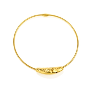 Detail of golden snake chain choker with irregular hammered texture metal pendant
