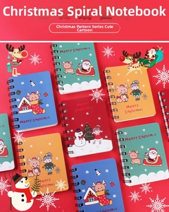 Close-up of assorted Christmas cartoon spiral notebooks with Santa and reindeer designs