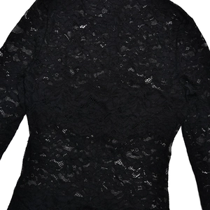 Close-up of intricate black floral lace pattern on a sexy sheer slim fit bodysuit