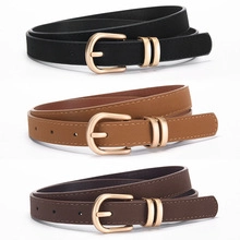 Detailed view of D-buckle leather belts in black and brown for elegant waist styling
