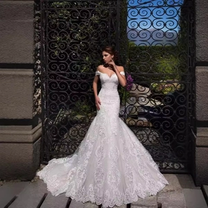 Elegant off-the-shoulder mermaid wedding dress with lace embroidery and a long bridal train