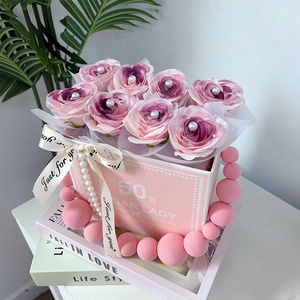 Pink soap rose gift box with pearl accents and plush ball handle for Valentine's Day