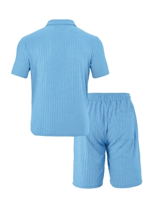 Close-up of light blue vertical striped knit fabric and fine stitching on men's set