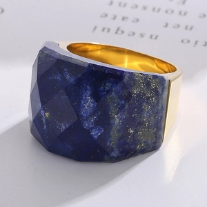 Macro view of multifaceted lapis lazuli stone set in 18K gold plated ring band