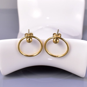 Detailed close-up of 18k gold plated stainless steel hoop earrings with sphere studs